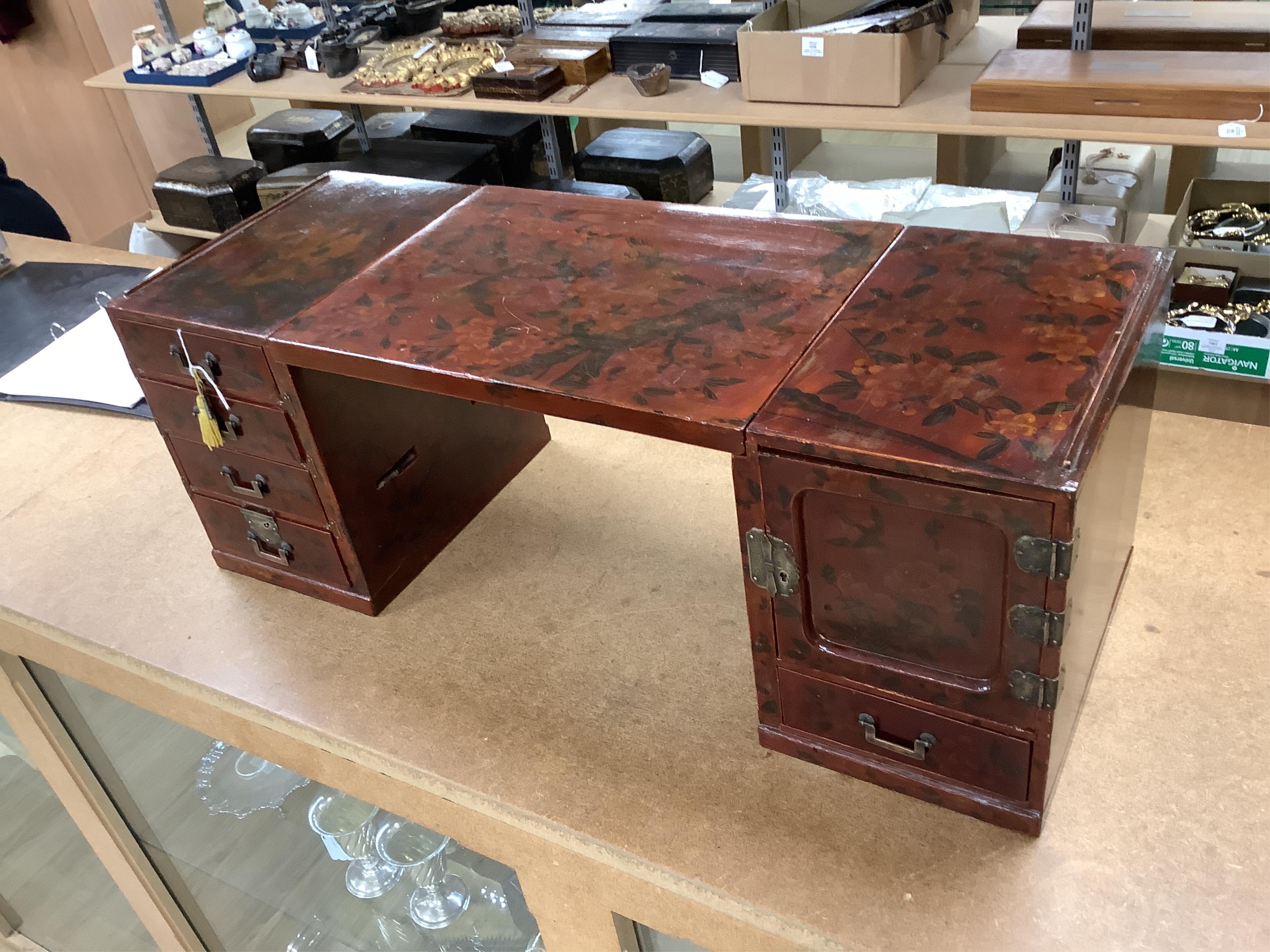 A Japanese floral lacquer table top cabinet, Taisho period, 36cm wide, the top panel is removable to form a twin pedestal cabinet